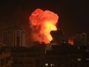 A fireball erupts during Israeli bombardment of Gaza City on October 9, 2023.