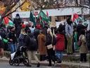 This image posted to X by @norlowsky -- and retweeted by Toronto Sun columnist Brian Lilley -- shows protesters carrying Hamas flags outside Queen's Park subway station on Sunday.