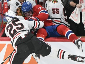 Montreal Canadiens forward Kirby Dach has sustained a "significant injury" and will be out for an extended period of time, the team announced Monday. Dach (77) is dumped into the Chicago bench by Blackhawks defenceman Jarred Tinordi during first period NHL hockey action in Montreal, Saturday, Oct. 14, 2023.