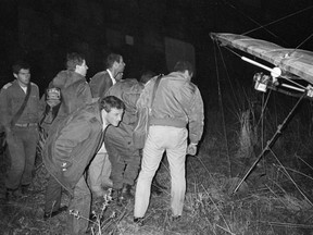 Israeli troops inspect the hang glider that a Palestinian guerrilla used to infiltrate Israel from Lebanon in an incident now known as the "Night of the Gliders" near Kiryat Shemona, Israel, Nov. 25, 1987.