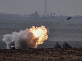 The Israeli military fires shells toward the Gaza Strip
