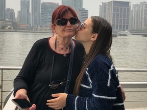 Grandmother getting kiss on cheek from granddaughter