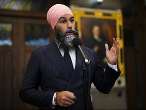 . NDP Leader Jagmeet Singh speaks to reporters in the foyer of the House of Commons on Parliament Hill in Ottawa on Wednesday, Oct. 4, 2023.