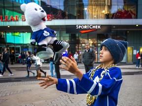 Idris Bieber has some fun with a stuffed Carlton the Bear before the Toronto Maple Leafs host the Montreal Canadiens at the Scotiabank Arena for the season opener in Toronto on Wednesday, Oct. 11, 2023. ERNEST DOROSZUK/TORONTO SUN