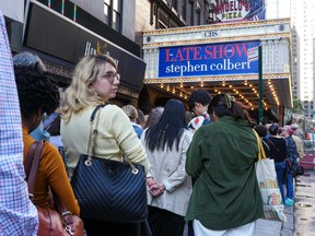Audience members line up outside of "The Late Show With Stephen Colbert" on Oct. 2, 2023 in New York City.