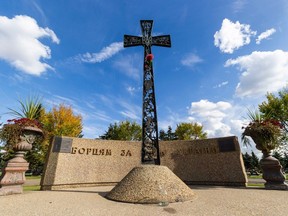 St. Michael's Cemetery monument is made up of a half circle of concrete and a giant metal cross on Thursday, Sept. 28, 2023, in Edmonton.
