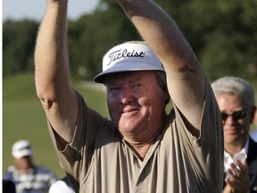 Andy Bean holds up the trophy after winning the Champions Tour's Greater Hickory Classic golf tournament at Rock Barn Golf and Spa's Jones Course in Conover N.C., Sunday, Oct. 1, 2006.