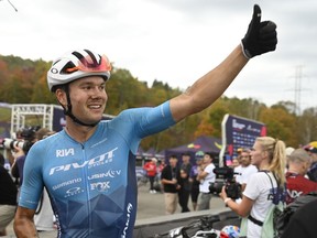 FILE PHOTO -- Gunnar Holmgren of Orillia Ont. gives the thumbs up at the mountain bike Cross-country Short Track event at the UCI World Cup, Friday, October 6, 2023 in Beaupre, Que. Holmgren won Canada's first gold medal at the Pan American Games on Saturday.