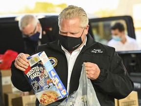 Ontario Premier Doug Ford delivers food at the Salvation Army food bank during the COVID-19 pandemic in Toronto on Friday, October 9, 2020.
