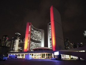 Toronto City Hall is seen illuminated at night in downtown Toronto on Friday, February 10, 2023.Toronto city councillors have voted to hike the city's vacant home tax.