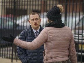 Josh Kruger, left, then the Communications Director