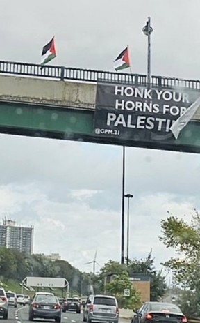 While hundreds are slaughtered in Israel, Pro-Palestinian demonstrators went to a bridge over the Gardiner Expressway to celebrate on Saturday, Oct. 7, 2023.
