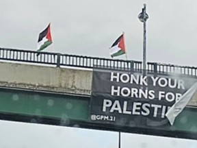 While hundreds are slaughtered in Israel, Pro-Palestinian demonstrators went to a bridge over the Gardiner Expressway to celebrate on Saturday, Oct. 7, 2023.