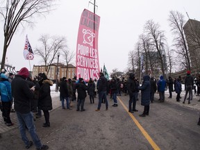 Union workers in the public sector demonstrate on the Grande-Allee in Quebec City, Wednesday, Nov. 25, 2020.