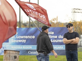 St. Lawrence Seaway workers picket in front of Niagara's Seaway Management Corporation offices Thursday, Oct. 26, 2023 in St. Catharines, Ontario.&ampnbsp;Unifor says it has reached a tentative agreement with the St. Lawrence Seaway Management Corp. during negotiations to end a strike that began Oct. 22.