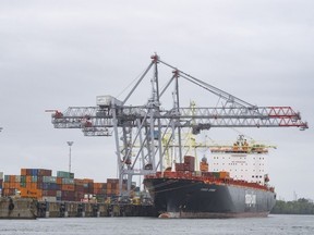 A container ship is loaded in the port of Montreal,