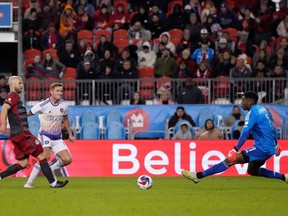 Toronto FC midfielder Michael Bradley (4) looks on as Orlando City forward Duncan McGuire (13) scores on Toronto keeper Sean Johnson (1) during second half MLS action in Toronto, Saturday, Oct. 21, 2023.