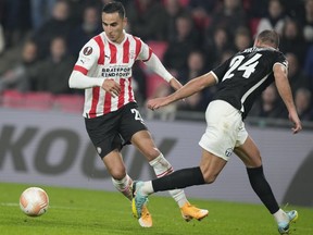 FILE - Then-PSV's and currently Bundesliga's Mainz player Anwar El Ghazi, left, scores his side's fifth goal during the Europa League group A soccer match between PSV and Zurich at the Philips stadium in Eindhoven, Netherlands, Thursday, Oct. 13, 2022. Bundesliga club Mainz has suspended Dutch forward Anwar El Ghazi for what it says was an "unacceptable" social media post about the latest Israel-Hamas war.