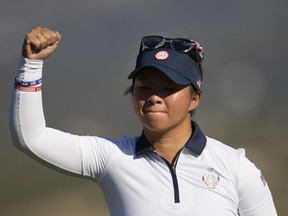 United States' Danielle Kang celebrates after putting on the 8th green during her foursome match with partner United States' Lexi Thompson at the Solheim Cup golf tournament in Finca Cortesin, near Casares, southern Spain, Saturday, Sept. 23, 2023. Europe play the United States in this biannual women's golf tournament, which played alternately in Europe and the United States .