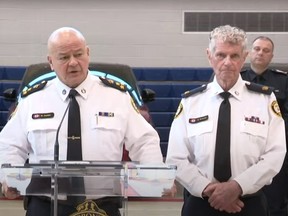 Toronto Police Chief Myron Demkyw, standing in front of five stolen vehicles recovered during Project Stallions with Supt. Ron Taverner at his side, reveals the final results of the 10-month auto theft investigation on Wednesday, Oct. 25, 2023.