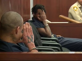 Teen murder suspects Jesus Ayala, front, and Jzamir Keys, laughing during court hearing.