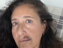 Olga Goldberg was punched in the punch Sunday for merely holding a poster of a female hostage in Gaza who is a friend of her daughter