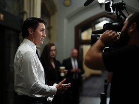 Prime Minister Justin Trudeau speaks to reporters as he arrives for a cabinet meeting in Ottawa, Tuesday, Oct. 3, 2023.