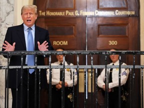Former U.S. president Donald Trump speaks during a break at his civil fraud trial at New York State Supreme Court on Oct. 18, 2023 in New York City.