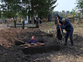 Local residents dig graves