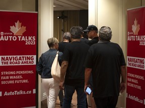 Unifor attendees enter their meeting with Stellantis as part of the auto talks in Toronto on Thursday, Aug. 10, 2023.