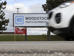 A Unifor flag waves in the wind in front of the sign at the Woodstock Parts Distribution Centre, in Woodstock, Ont., on Tuesday, Oct. 10, 2023.