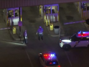 police cars and officers around a Philadelphia International Airport parking garage