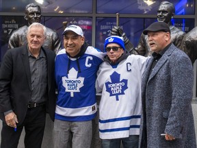 Maple Leafs alumni Darryl Sittler and Wendel Clark pose with fans and sign autographs before the Toronto Maple Leafs host the Montreal Canadiens at the Scotiabank Arena for the season opener in Toronto on Wednesday, Oct. 11, 2023. ERNEST DOROSZUK/TORONTO SUN