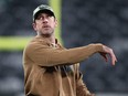 Aaron Rodgers of the New York Jets throws a football before the game against the Los Angeles Chargers.