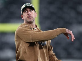 Aaron Rodgers of the New York Jets throws a football before the game against the Los Angeles Chargers.