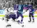 Toronto Maple Leafs centre Calle Jarnkrok (19) celebrates scoring the winning goal with defenceman Morgan Rielly (44) as Tampa Bay Lightning goaltender Jonas Johansson skates off the ice.