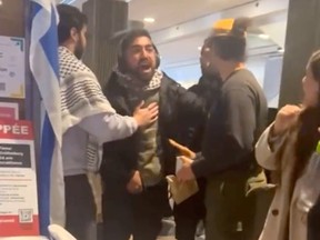 An image from a video circulating on social media shows a Palestinian supporter yelling at a group of Israeli supporters at a table with posters of kidnapped Israelis, at Concordia University on Wednesday, Nov. 8, 2023.