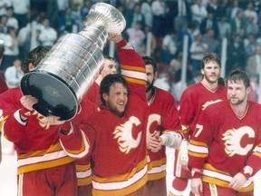 Calgary Flames' Mike Vernon celebrates with the Stanley Cup in 1989.