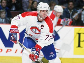 Pierre Turgeon of the Montreal Canadiens looks to make pass during a game.