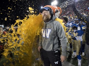 Winnipeg Blue Bombers head coach Mike O'Shea gets a sports drink poured over him as his team defeats the Hamilton Tiger Cats in the 107th Grey Cup.