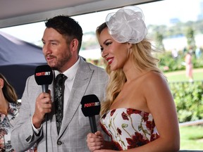 Former professional golfer and now social media personality, Paige Spiranac is seen presenting for Points Bet with Dale Thomas (L) during Melbourne Racing in 2023.