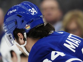 Toronto Maple Leafs' Auston Matthews (34) wears a pride-themed sticker on his helmet.