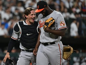 Catcher Adley Rutschman of the Baltimore Orioles talks with pitcher Félix Bautista.