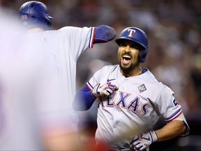 Marcus Semien #2 of the Texas Rangers celebrates after hitting a home run in the third inning against the Arizona Diamondbacks during Game Four of the World Series at Chase Field on October 31, 2023 in Phoenix, Arizona. (Photo by Christian Petersen/Getty Images) *** BESTPIX ***