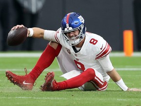 Daniel Jones of the New York Giants reacts after falling down.