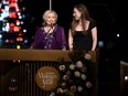 Hillary Rodham Clinton and Chelsea Clinton speak onstage.