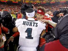 Jalen Hurts #1 of the Philadelphia Eagles talks with Patrick Mahomes #15 of the Kansas City Chiefs after their game at GEHA Field at Arrowhead Stadium on November 20, 2023 in Kansas City, Missouri.