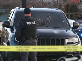 Calgary Police are shown at the scene of a fatal shooting in the parking lot at Trans Canada Mall near 16 Ave and 52 St NE on Monday, November 13, 2023.