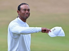 U.S. golfer Tiger Woods gestures to the crowd.