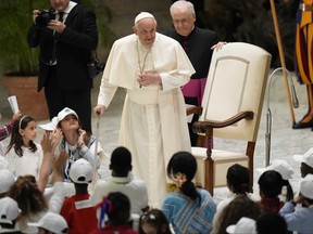 Pope Francis arrives for an audience with children from all over the world in the Paul VI Hall at The Vatican, Monday, Nov. 6, 2023.